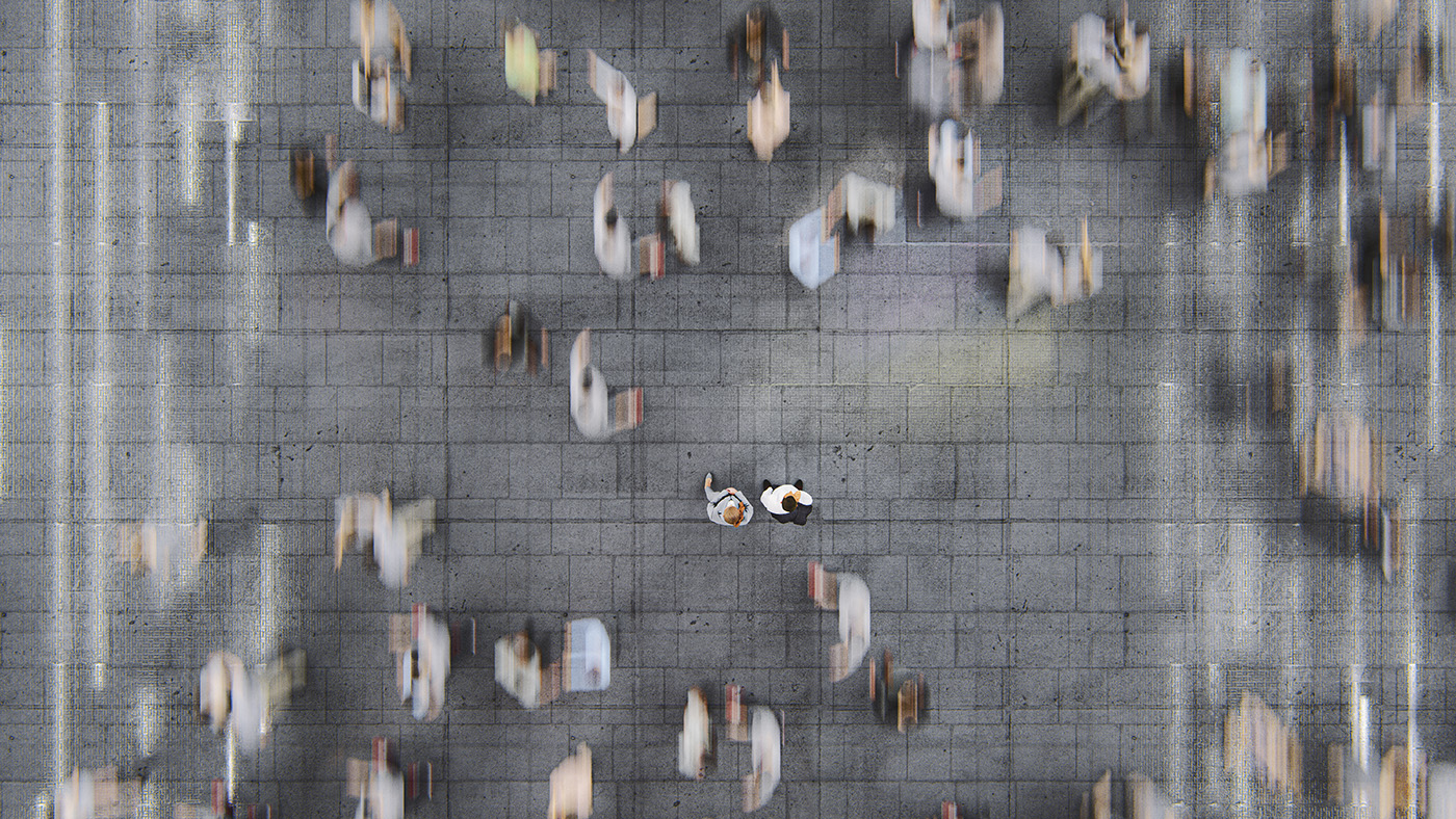 Businessman standing in the fast moving crowds of commuters